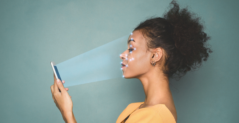  Woman Looking at Phone with Facial Scan