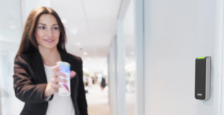 Woman unlocking door with smart phone