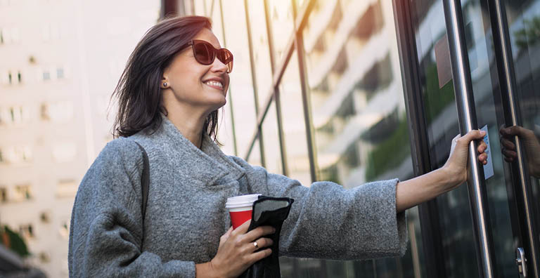 Woman entering building from outside