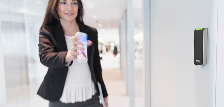 Woman unlocking door with smart phone