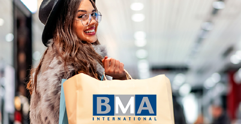 smiling woman holding a shopping bag