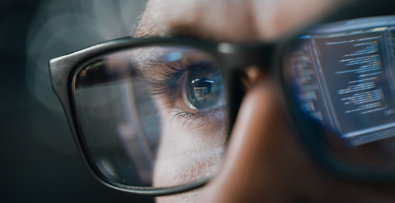 A computer screen reflection in glasses