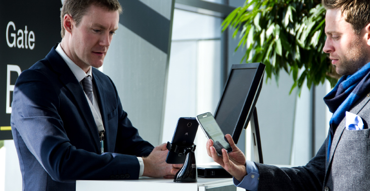 Person showing ID on smart phone at airport