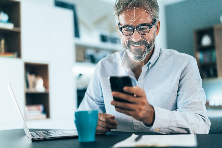 person using facial recognition on phone