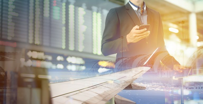 person in airport looking at phone