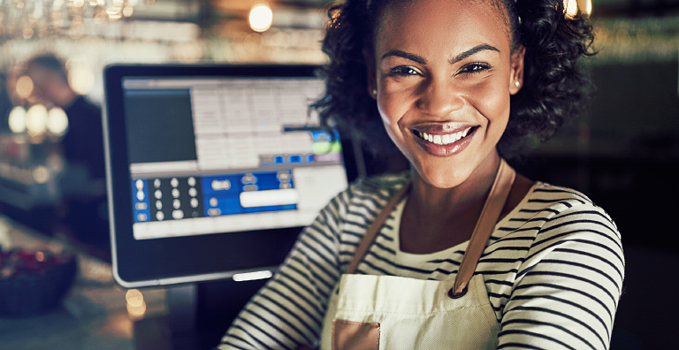 person standing in front of cash register